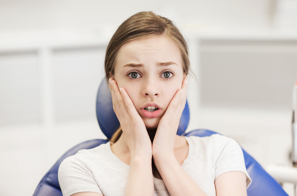 patient scared in a dental chair